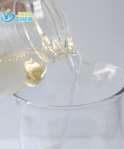 Amber-colored APG (Alkyl Polyglucoside) liquid surfactant being poured, showing viscosity and flow characteristics