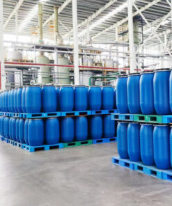 Industrial warehouse storing LABSA (Linear Alkylbenzene Sulfonic Acid) in IBC totes and drums, organized chemical storage