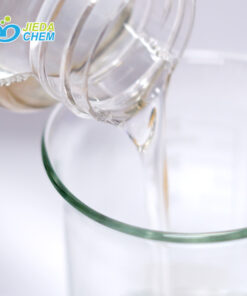 The transparent liquid Peg-6 Caprylic/Capric Glycerides contained in the small bottle is being poured into the beaker