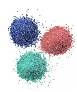 Color speckles of blue, green and red colors placed on white paper
