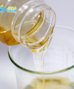 Pour the pale yellow liquid disodium cocoamphodiacetate from the small bottle into the beaker